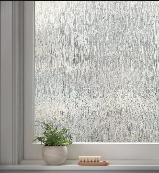 Reeded decorative privacy film on a window