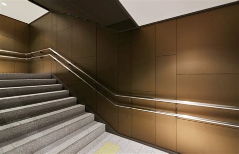 Stairwell walls finished in bronze metallic architectural film